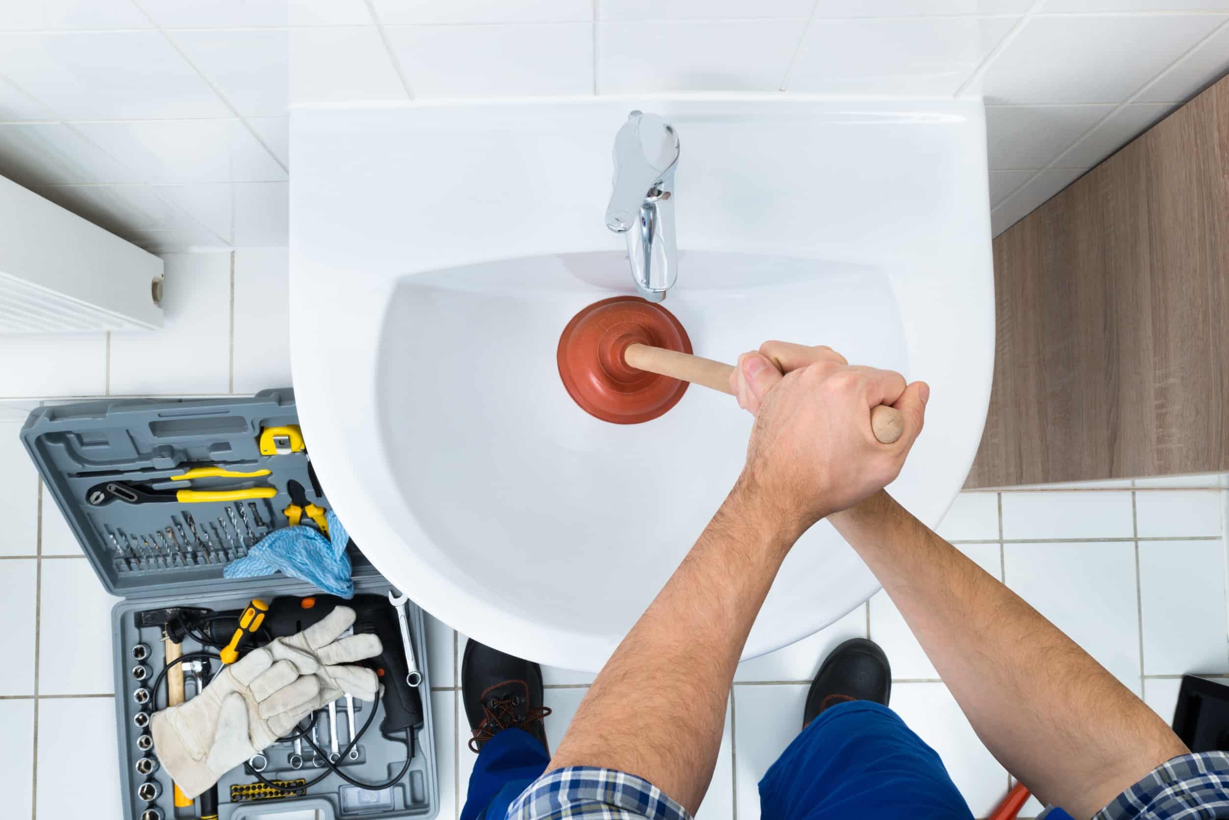 greer plumber plunging clogged sink drain