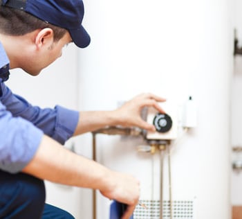 plumber adjusting temperature on water heater in greer, sc